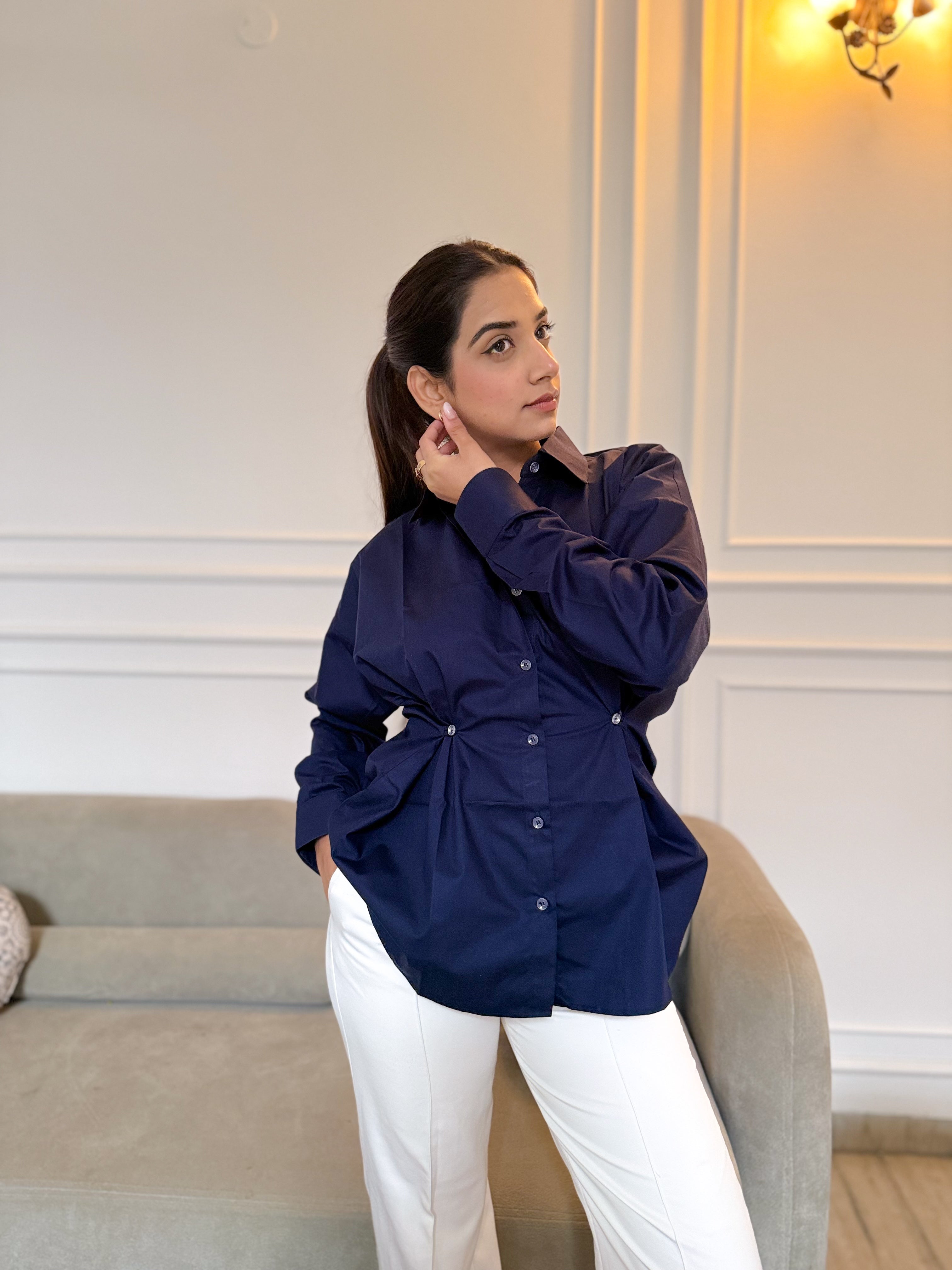 Navy blue cotton shirt cinched waist detail close-up
